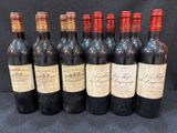 six bouteilles de vin rouge alignées