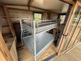 a bunk bed in the middle of a room