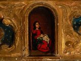 a painting of a woman in a red dress sitting in a chair