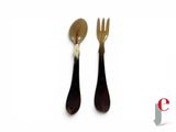 two forks and spoons on a white background with a red and white logo