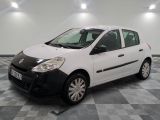 a picture of a small white car parked in a garage