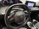 the interior of a car with a steering wheel and dashboard controls