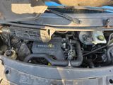 a picture of a car engine with its hood open