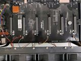 a close up of a computer board with wires attached to it