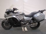 a motorcycle that is parked on a black and white checkered floor