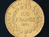 an image of a gold coin with a wreath of leaves on it