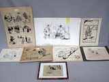 plusieurs dessins, encadrés ou non, représentant des personnes et des animaux, posés sur une table