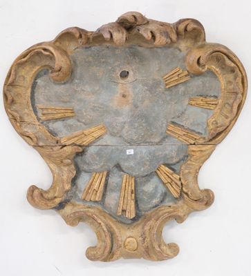 a clock on the wall with roman numerals on it