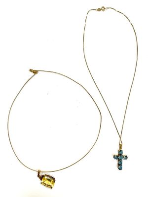 a necklace with a cross pendant and a cross pendant on a chain