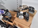 many different types of cameras on display on a table