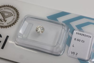 an image of a diamond in a clear box on a white surface