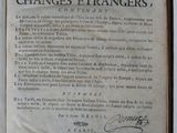 an old book with writing on it sitting on top of a table