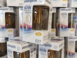 several boxes of electric light bulbs stacked on top of each other