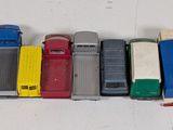 a lot of toy trucks that are lined up on the table