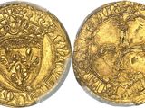 a gold coin with a shield on the front and a shield on the back