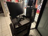a computer desk with two monitors on top of it