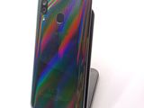 the back view of a phone with a multicolored design on it