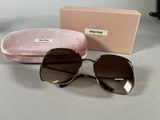 michael korsh sunglasses in brown and gold with pink case