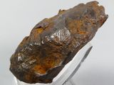 an image of a piece of rock on a clear stand