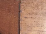 a close up of a drawer with a wooden handle on it