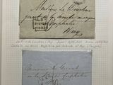 an old piece of paper with writing on it sitting on top of a piece of paper