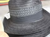 several hats are stacked on top of each other on a table