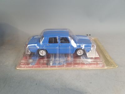 a blue toy car in a clear plastic box