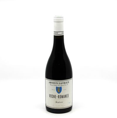 a bottle of wine that is sitting on a table