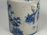 a blue and white container with a bird on it