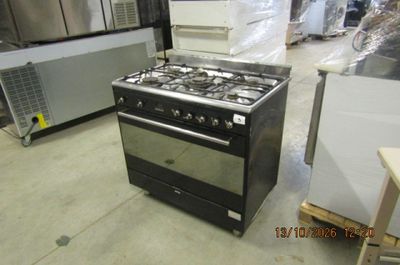 a stove that is sitting in the middle of a room