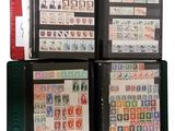 a lot of stamps in a binder on the table