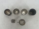four different types of metal knobs on a white surface