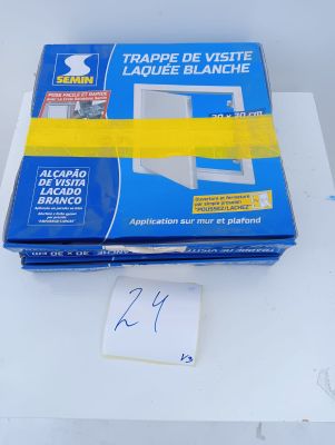 a box of tape on a table with a sticker on it