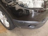 a close up of a car ' s front bumper and headlight