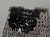 a close up of a vase with a black and white design