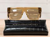the sunglasses are sitting on top of a black case