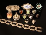 a lot of different rings and bracelets on a table