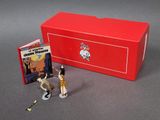 toy figurines of a giraffe and a giraffe in front of a red box