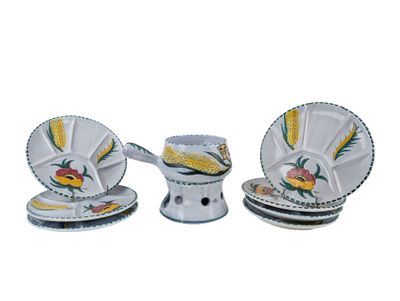 three pieces of white and yellow dinnerware on a white table