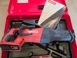 a red tool box with tools in it sitting on the floor