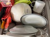 a close up of a kitchen sink filled with dishes and utensils