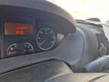 a close up of a car dashboard with a clock on it