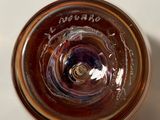 a close up of a glass with a liquid inside of it