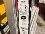 a close up of a parking meter with a sticker on it