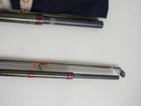 two different types of fishing rods on the table