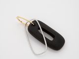 an image of a black and gold necklace with a long chain