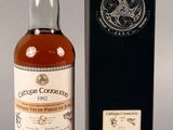 an image of a bottle of whisky next to a black box