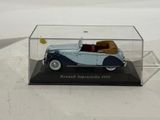 a model of a blue and white car in a clear case
