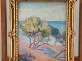an oil painting of a beach scene on a wooden easel