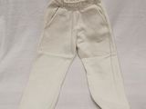white pants on a white sheet with a white background